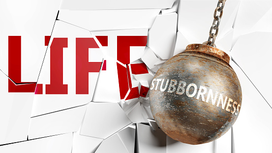 Stubbornness and life - pictured as a word Stubbornness and a wreck ball to symbolize that Stubbornness can have bad effect and can destroy life, 3d illustration