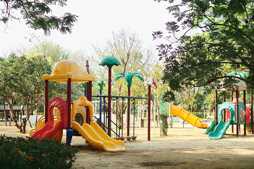 Colorful children playground, without children in the public park during the Covid-19 health crisis, Coronavirus outbreak, Bangkok Thailand