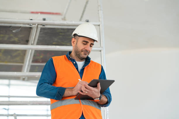 istock Young engineer in protective clothing checks the work done 1303426398