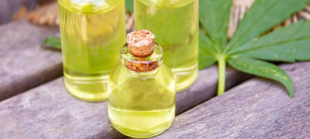 istock Cannabis essential oil in a small bottle. Selective focus. 1303428477
