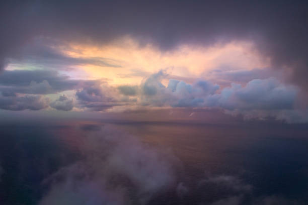 istock clouds seen from an airplane with the sea in the background 1303429718