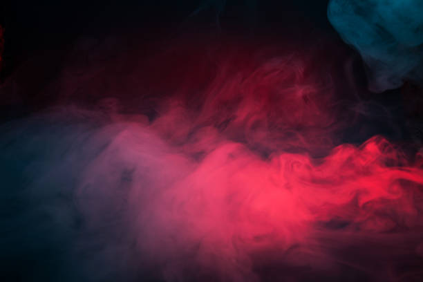 istock Colorful smoke on a black background 1303430349