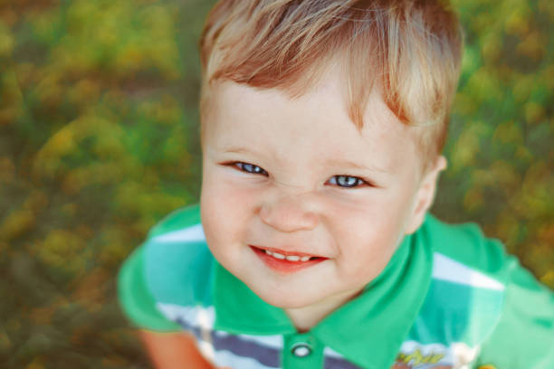 istock a child plays among the grass 1303431636