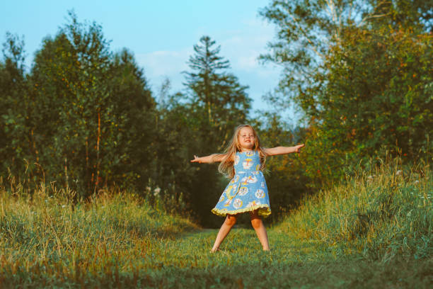 istock child in the garden on a Sunny day 1303431668