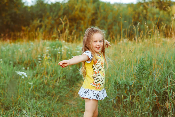 istock child in the garden on a Sunny day 1303431741