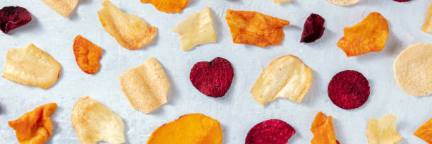 istock Various vegetable chips panorama, shot from the top 1303434346
