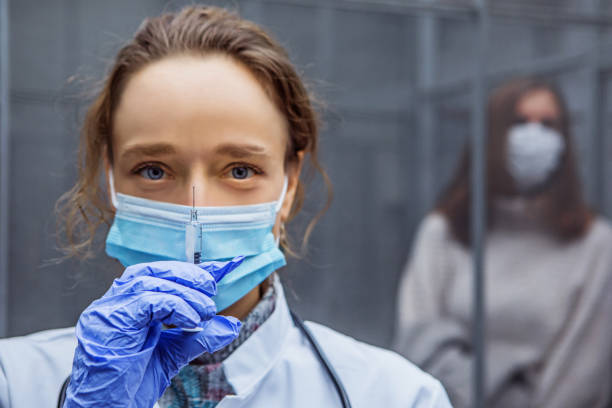 istock Covid-19 vaccinations in an indoor medical setting 1303434395