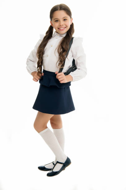 istock Learn how fit backpack correctly for school. Schoolgirl cute in formal uniform wear backpack. School backpack concept. Right and wrong ways to wear backpack to prevent pain and keep proper posture 1303435650