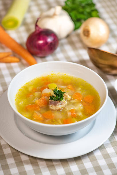 istock Fresh Vegetable soup in a white bowl , Traveling 1303440370