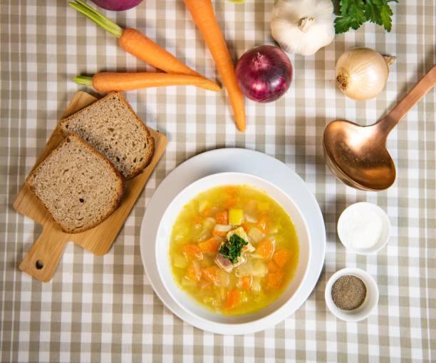 istock Fresh Vegetable soup in a white bowl , Traveling 1303441909