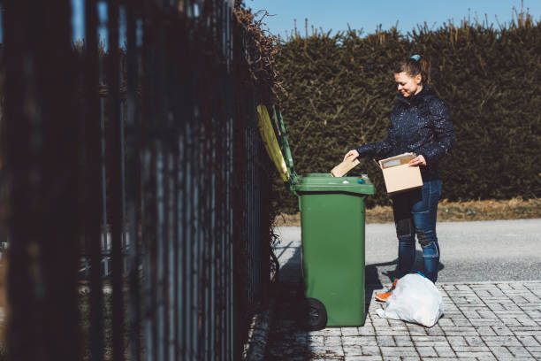 istock Young caucasian woman recycling plastic waste outside 1303442114