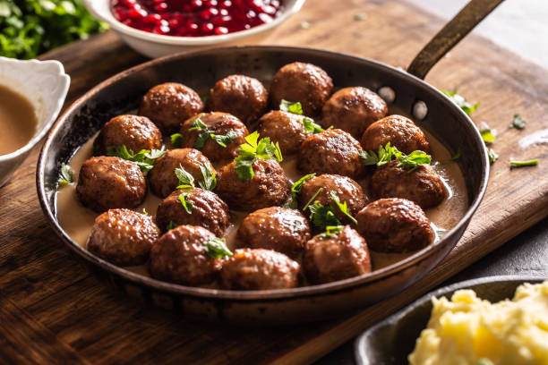 istock Pan with freshly-made kottbullar meatballs in a sauce 1303442142