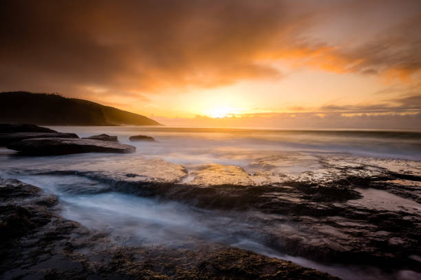 istock Sunrise Scape of Pretty Beach 1303450606