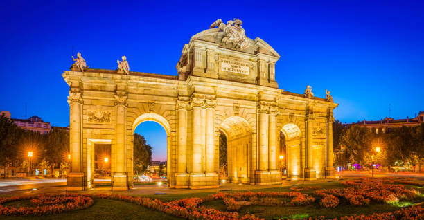 istock Madrid Puerta de Alcala iconic landmark illuminated at dusk panorama Spain 1303451721