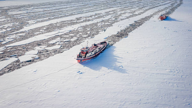 istock Two icebreakers on Vistula river crush the ice in winter 1303454135