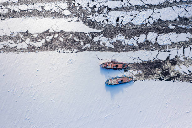 Aerial view of icebreakers on Vistula river crush ice