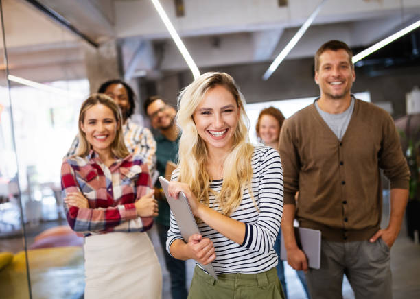 istock Successful company with happy employees in modern office 1303454438