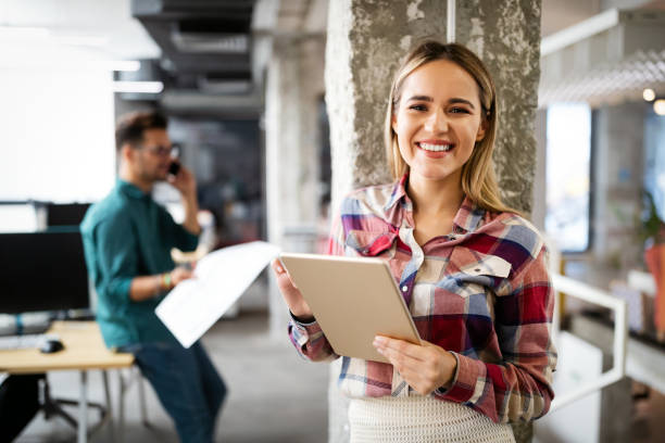 istock Business people having fun and chatting at workplace office 1303454450