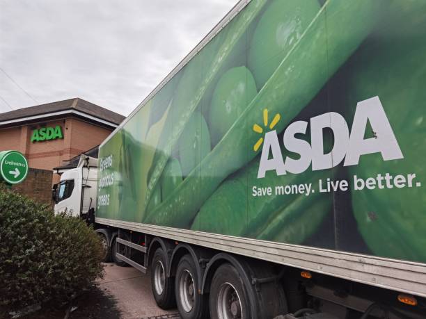 The delivery truck parked outside the ASDA supermarket. London,UK- February 20, 2021: The delivery truck parked outside the ASDA supermarket.Asda Stores Ltd (originally Associated Dairies) is a British supermarket chain. asda photos stock pictures, royalty-free photos & images