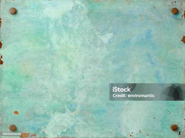 Old Metal Weathered Turquoise Colored Copper Patina Plate Against A Rusty Metal Plate Background The Copper Plate Is Bolted By Bolts Onto The Rusty Steel Background Stock Photo - Download Image Now