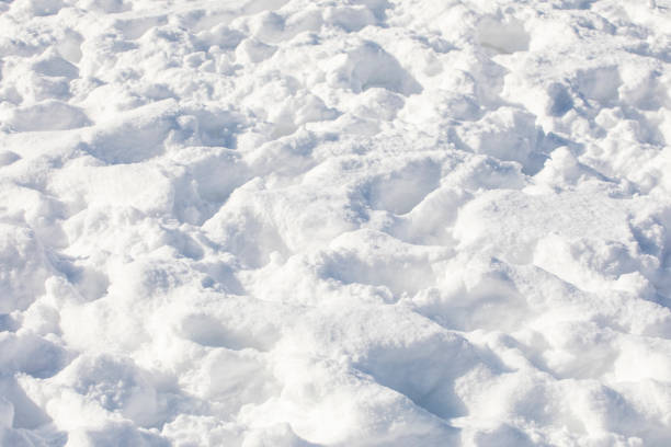 istock footprints in ice-covered snow drifts, horizontal texture 1303456801
