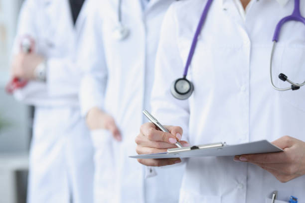 istock Doctors in white medical coats stand together 1303456967