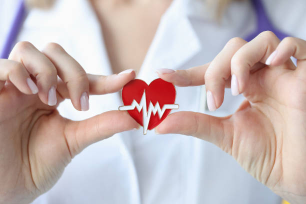 Doctor holds in his hands an icon with cardiogram of heart Doctor holds in his hands an icon with cardiogram of heart. Heart and vascular disease concept pericarditis stock pictures, royalty-free photos & images