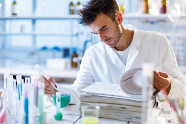 istock Young student of science working on medical research in laboratory. 1303459952