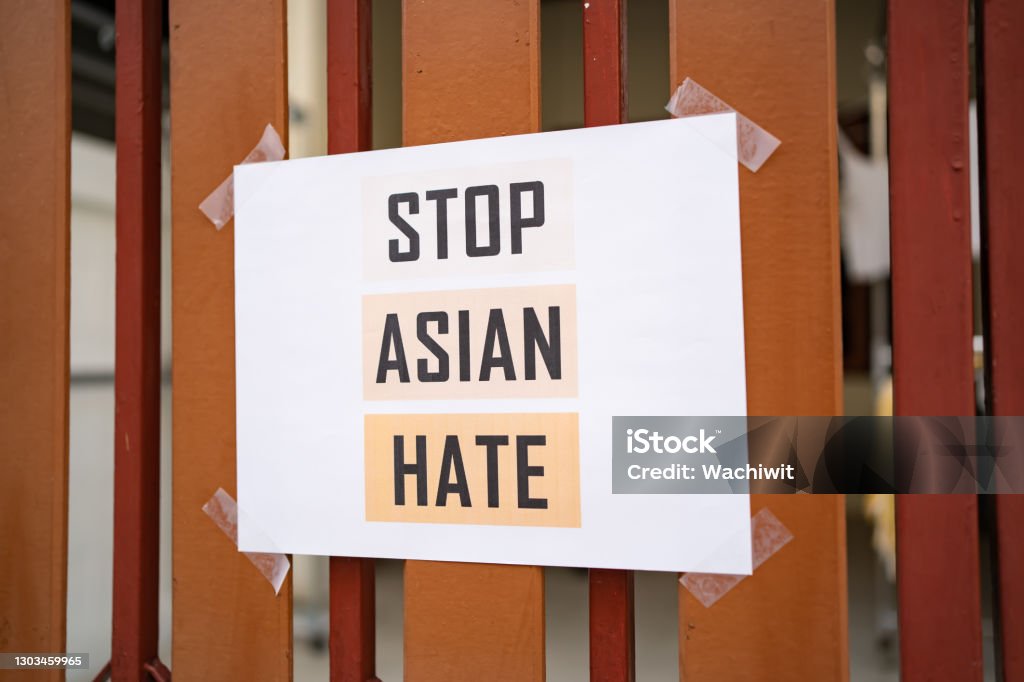 Stop Asian Hate sign was attached on the house fence Asia Stock Photo