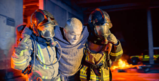 istock Senior man being rescued by firefighters 1303463209