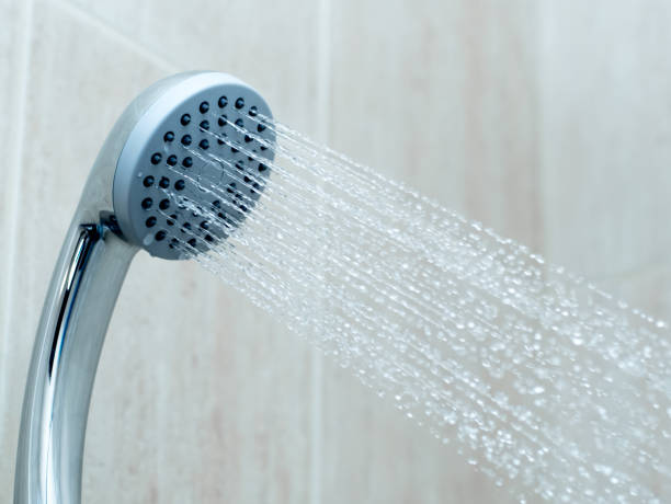 istock Shower head with water stream in the bathroom. Clean shower 1303463362