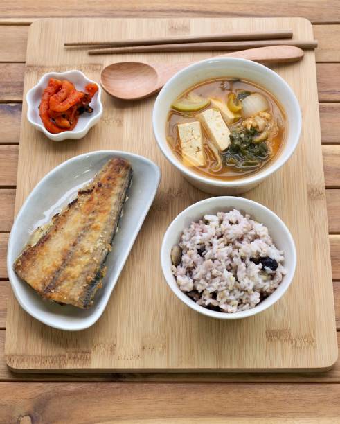 istock Asian food grilled fish, rice, miso soup 1303464348