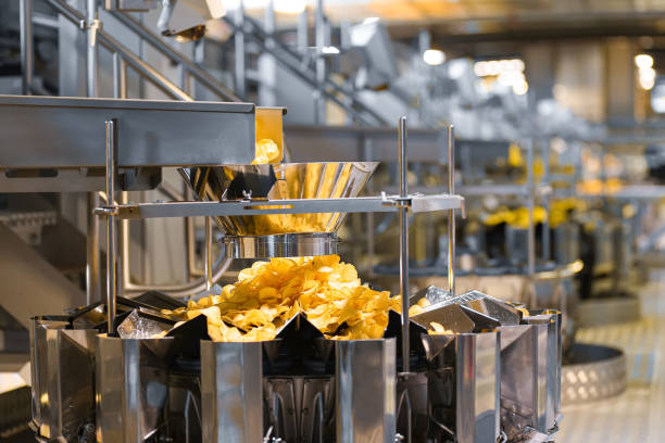 istock Line for the production and packaging of potato chips 1303465616