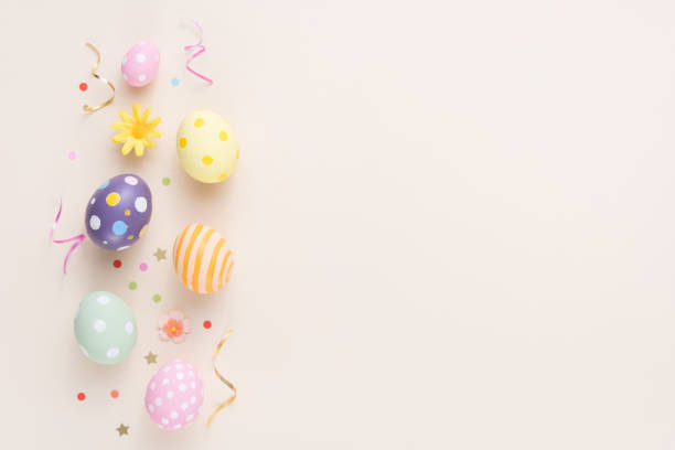 istock Happy Easter day colorful eggs and flower decoration on paper background with copy space 1303465962