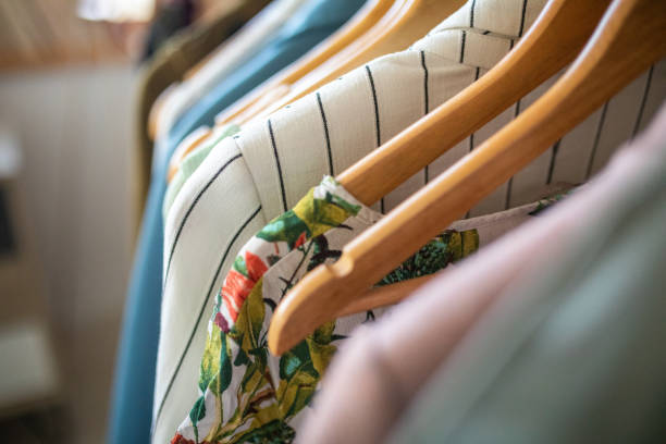 istock Clothing on coat hangers in e-commerce shop 1303466327