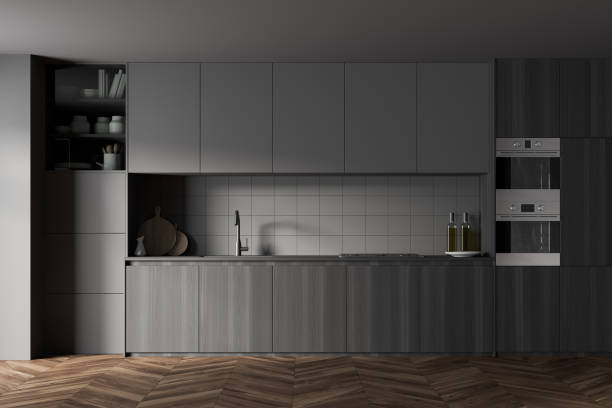 istock Gray and wooden kitchen with cupboards 1303466981