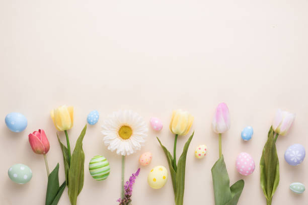 istock Happy Easter day colorful eggs and flower decoration on paper background with copy space 1303467057