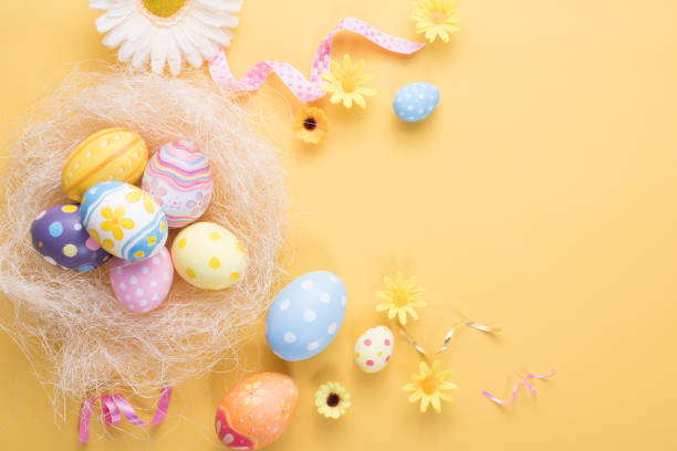 istock Happy Easter day colorful eggs and flower decoration on paper background with copy space 1303467253