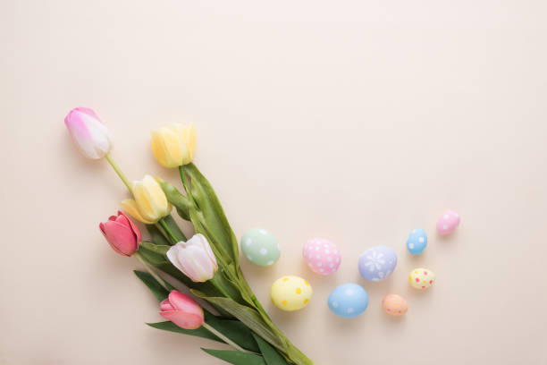 istock Happy Easter day colorful eggs and flower decoration on paper background with copy space 1303467442