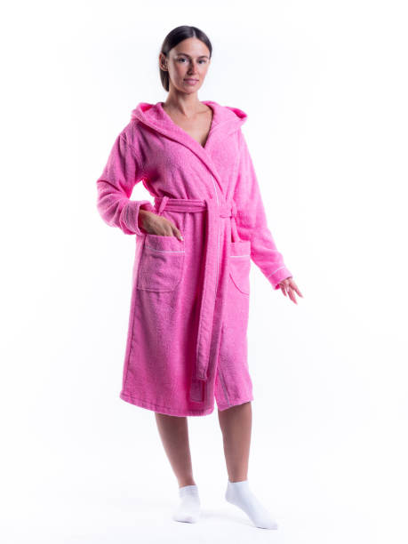 istock woman in a Bathrobe on an isolated white background with a smile on her face. 1303470708