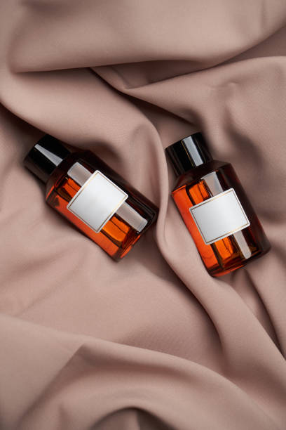 istock Essential oil bottles on pastel color background with copy space 1303470861