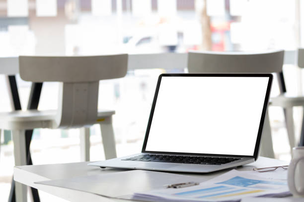 istock Laptop computer with mockup or blank screen on white desk in workspace and copy space concept 1303470879