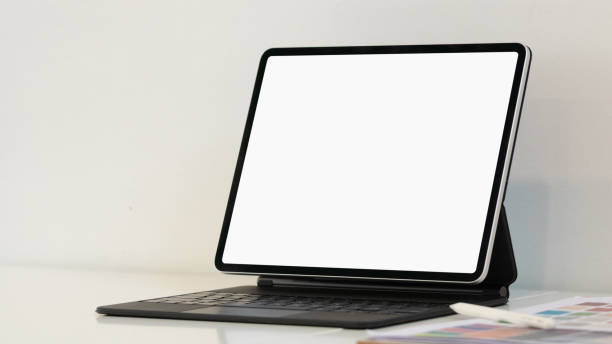 istock Laptop computer with mockup or blank screen on white desk in workspace and copy space concept 1303471796