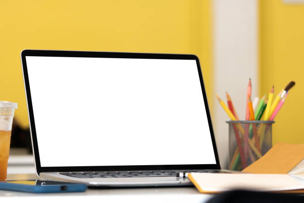 istock Laptop computer with mockup or blank screen on white desk in workspace and copy space concept 1303472060