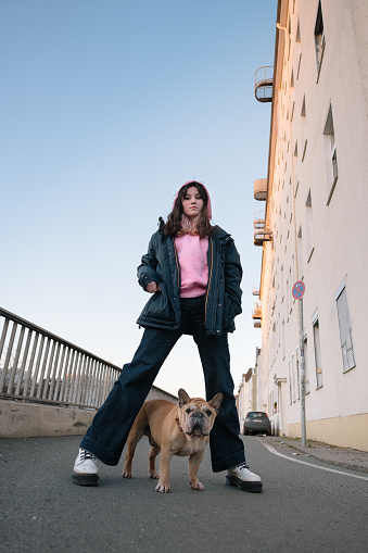 Teenage girl portrait with french bulldog