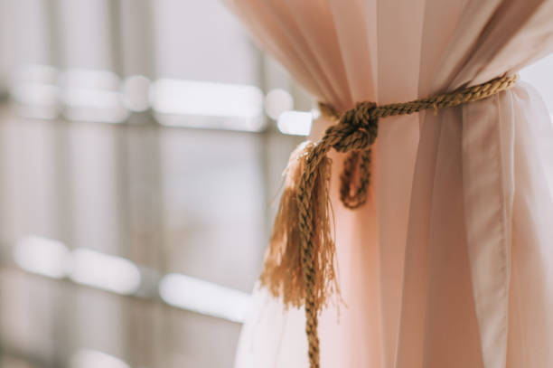 white rope loop hanging against blurry background