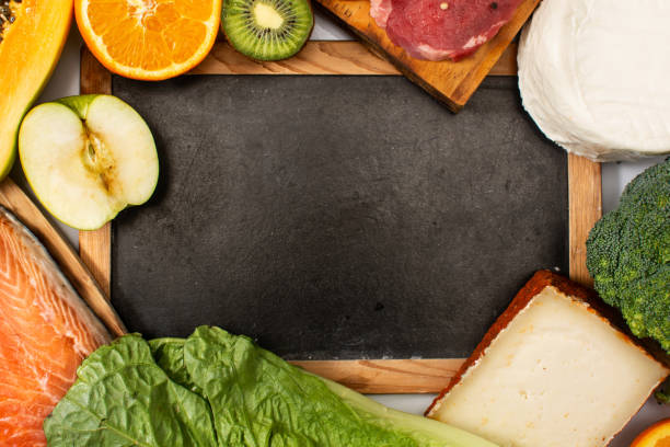 istock Vitamin A in food and blackboard mockup 1303475396