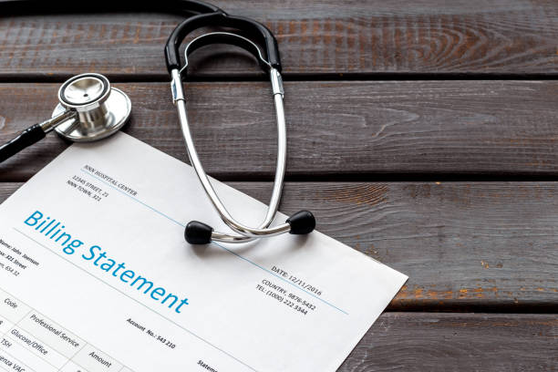 istock Medical Billing Statement form with stethoscope. Medical care concept. 1303476100