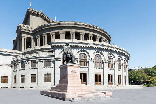 Yerevan, Armenia - September 18, 2019: Hovhannes Tumanyan statue, designed by architect Grigor Aghababayan and executed by sculptor Ara Sargsyan in 1957, located in Yerevan Opera Theatre in Freedom Square