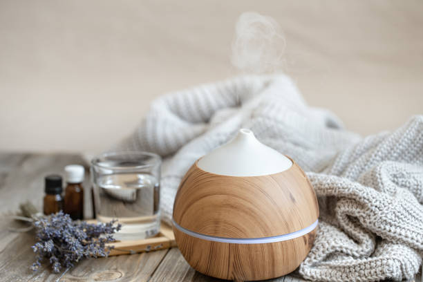 istock Composition with an air humidifier and a set of aromatic oils. 1303477855